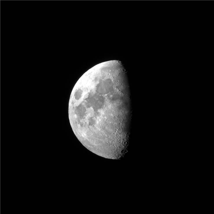 Picture Of Half Moon Seen From A Small Telescope